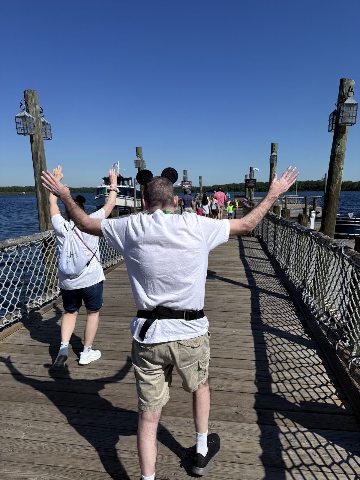 J&J walking the Fort Wilderness marina dock toward the ferry